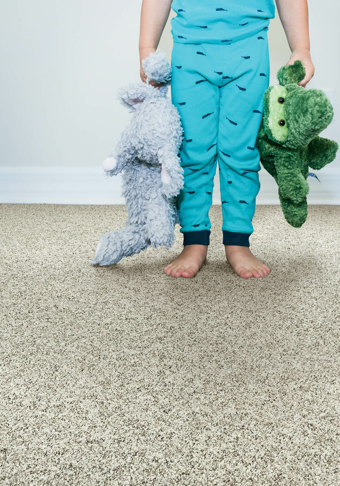 Kid with toys | Flooring & Tile World